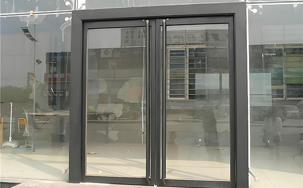 米脂玻璃地弹门